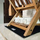 Wood Ceylon small dish drying rack with wooden frame holding white cups on kitchen counter