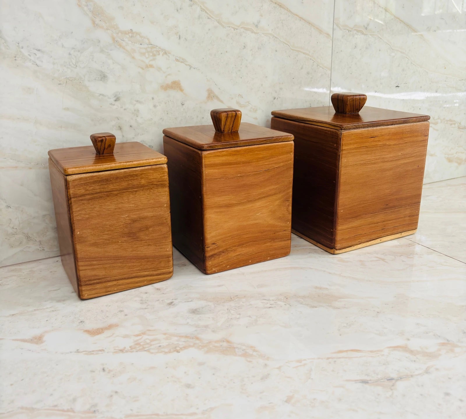 Wood Ceylon wooden kitchen canister set of 3 with square shape and lids on marble countertop